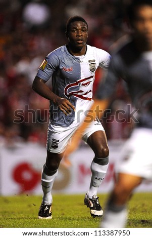 BANGKOK,THAILAND-SEPTEMBER1:	Jerry (white) of Insee Police Utd.in action during Thai Premier League between BEC Tero F.C.and Insee Police Utd. at Thephasadin Stadium on Sep1,2012 inThailand