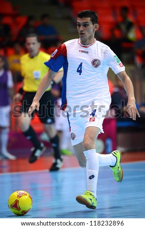 BANGKOK,THAILAND-NOVEMBER 04:Luis Navarrete of Costa Rica runs with the ball during the FIFA Futsal World Cup between Paraguay and Costa Rica at Indoor Stadium Huamark on Nov4,2012 in Thailand.