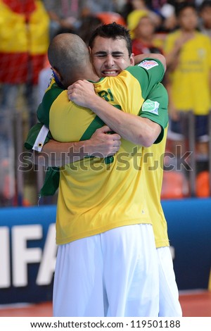 BANGKOK,THAILAND - NOVEMBER18:Neto of Brazil celebrates with team mate  the FIFA Futsal World Cup Final between Spain and Brazil at Indoor Stadium Huamark on Nov18, 2012 in ,Thailand.