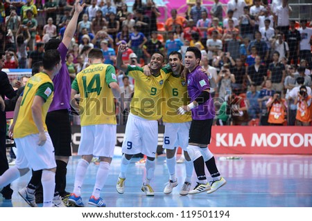 BANGKOK,THAILAND - NOVEMBER18:Je (no.9) of Brazil celebrates with team mate  the FIFA Futsal World Cup Final between Spain and Brazil at Indoor Stadium Huamark on Nov18, 2012 in ,Thailand.