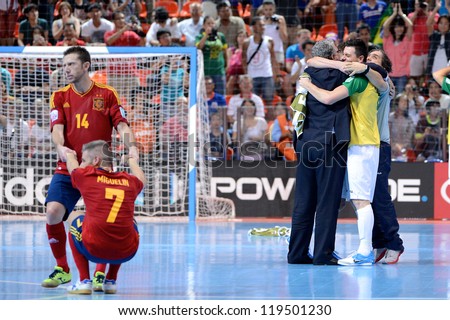 BANGKOK,THAILAND - NOVEMBER18:Players ( yellow) of Brazil celebrates with team mate  the FIFA Futsal World Cup Final between Spain and Brazil at Indoor Stadium Huamark on Nov18, 2012 in ,Thailand.