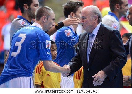 BANGKOK,THAILAND -NOVEMBER 18: FIFA President Joseph S. Blatter shakes hands with players of Italy prior to the FIFA Futsal World Cup 3rd/4th match at Indoor Stadium Huamark on Nov18,2012 in,Thailand.
