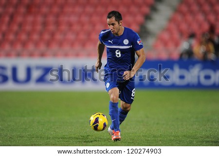 BANGKOK THAILAND-NOVENBER 27:Dennis Mengoy Cagara of Philippines runs with the ball during  the AFF Suzuki Cup between Vietnam and Philippines at Rajamangala stadium on Nov27, 2012 in,Thailand.