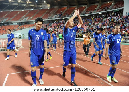 BANGKOK THAILAND-NOVEMBER 27:Panupong Wongsa #2 of Thailand celebrates with team mate during the AFF Suzuki Cup between Thailand and Myanmar at Rajamangala stadium on Nov27, 2012 in Bangkok,Thailand.