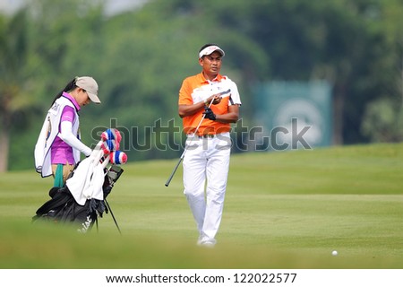CHONBURI,THAILAND-DECEMBER 6:Thaworn Wiratchant of Thailand  see lines up before a shot during hole 2 day one of the Thailand Golf Championship at Amata Spring Country Club on Dec 6,2012 in,Thailand.