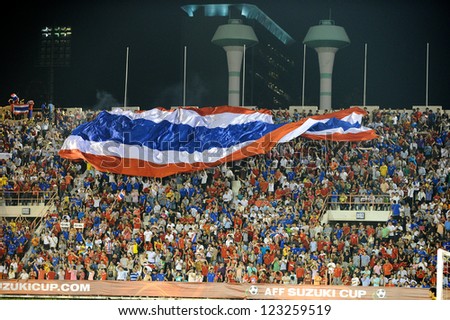 BANGKOK THAILAND-DECEMBER 13:unidentified fans of Thailand Flag supporters  during the AFF Suzuki Cup between Malaysia and Thailand at Supachalasai stadium on Dec13,2012 in Bangkok,Thailand.
