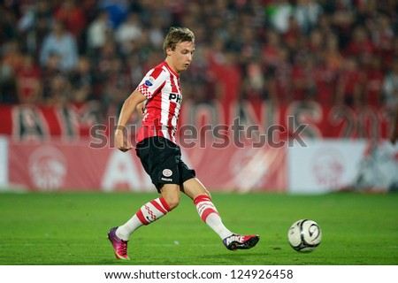 BANGKOK,THAILAND-JANUARY 8: 	Marcel Ritzmaier (RED) of PSV in action during The AIA Champions Cup match between SCG Muangthong Utd. and PSV at SCG Stadium on Jan8 ,2012 in ,Thailand.
