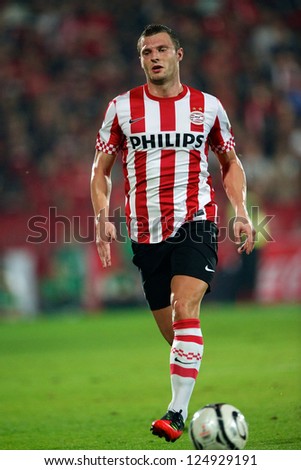 BANGKOK,THAILAND-JANUARY 8: Erik Pieters (RED) of PSV in action during The AIA Champions Cup match between SCG Muangthong Utd. and PSV at SCG Stadium on Jan8 ,2012 in ,Thailand.