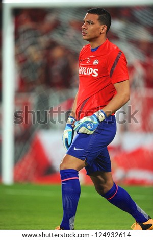 BANGKOK,THAILAND-JANUARY 8: Boy Waterman of PSV look on during The AIA Champions Cup match between SCG Muangthong Utd. and PSV at SCG Stadium on Jan8 ,2012 in ,Thailand.