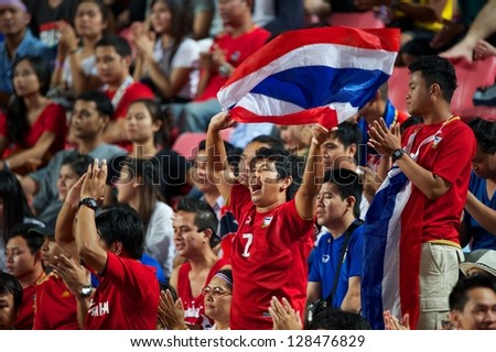 BANGKOK THAILAND-FEBRUARY 06:unidentified fans of Thailand Flag supporters during the football 2015 Asian Cup qualifying between Thailand and Kuwait at Rajamangala stadium on Feb 06, 2013 in,Thailand.