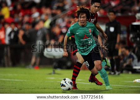 NONTHABURI,THAILAND-MAY 01:Shinya Yajima #29 of Urawa Red Diamonds in action during the AFC Champions League between Muangthong Utd.and Urawa Red Diamonds at SCG stadium on May 1,2013 in,Thailand.