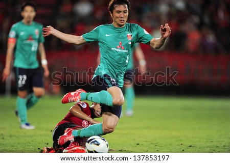 NONTHABURI,THAILAND-MAY01:Daisuke Nasu #4 of Urawa Red Diamonds in action during the AFC Champions League between Muangthong Utd.and Urawa Red Diamonds at SCG Stadium on May1,2013 in,Thailand.