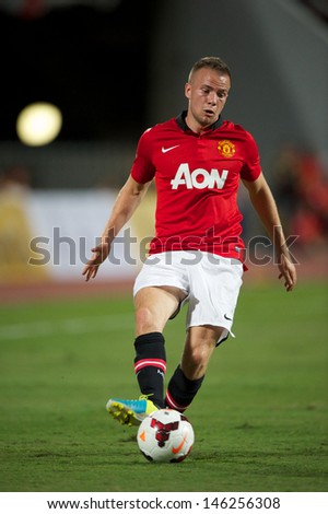 BANGKOK THAILAND-JULY13: Tom Cleverly of Manchester United looks to pass during the friendly match between Singha All Star XI and Manchester United at Rajamangala Stadium on July13,2013 in Thailand.
