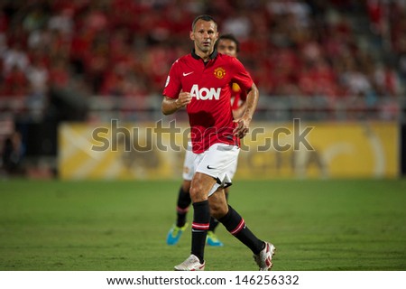 BANGKOK,THAILAND-JULY13: Ryan Giggs of Manchester United run during the friendly match between Singha All Star XI and Manchester United at Rajamangala Stadium on July 13, 2013 in Thailand.