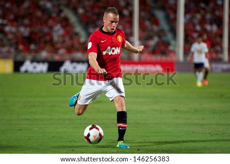 BANGKOK THAILAND-JULY13: Tom Cleverly of Manchester United looks to pass during the friendly match between Singha All Star XI and Manchester United at Rajamangala Stadium on July13,2013 in Thailand.