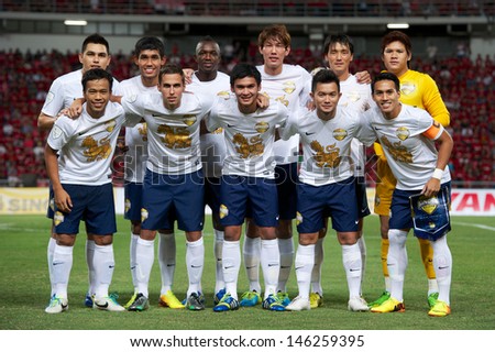BANGKOK THAILAND-JULY13:Players of Singha All Star XI shoot photo during the friendly match between Singha All Star XI and Manchester United at Rajamangala Stadium on July13,2013 in Thailand.