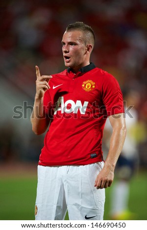 BANGKOK THAILAND-JULY13:Tom Cleverley of Manchester United in action during the friendly match between Singha All Star and Manchester United at Rajamangala Stadium on July13,2013 in Thailand.