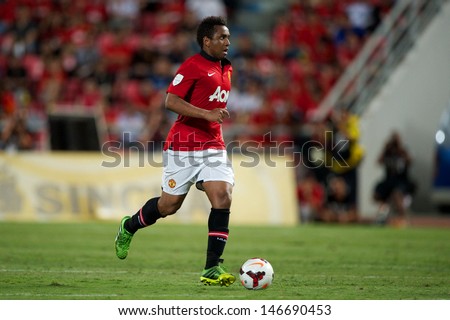 BANGKOK THAILAND-JULY13:Anderson of Manchester United run with the ball during the friendly match between Singha All Star XI and Manchester United at Rajamangala Stadium on July13,2013 in Thailand.