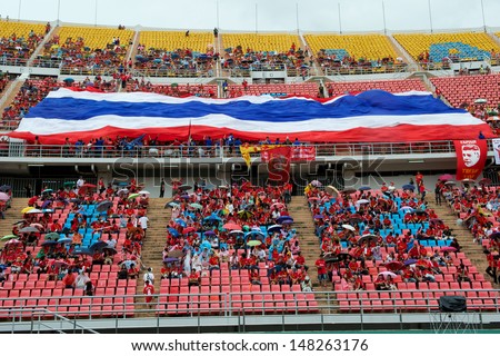 BANGKOK,THAILAND-JULY28:Unidentified fan of Thailand national flag supporters during the international friendly match Thailand and Liverpool at Rajamangala Stadium on July 28,2013 in Bangkok,Thailand.
