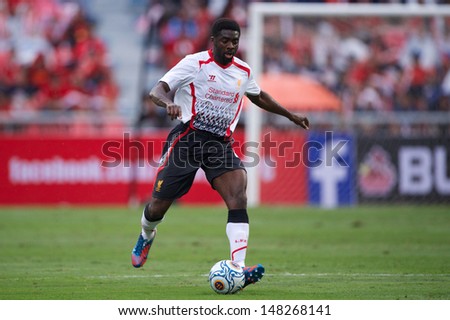 BANGKOK,THAILAND-JULY 28:	Kolo Toure of Liverpool run with the ball during the international friendly match Thailand and Liverpool at the Rajamangala Stadium on July 28,2013 in,Thailand.