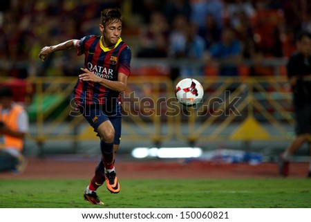 BANGKOK,THAILAND-AUGUST 07:Neymar JR of Barcelona run with the ball during the international friendly match between Thailand XI and FC Barcelona at Rajamangala Stadium on August 7,2013 in,Thailand.