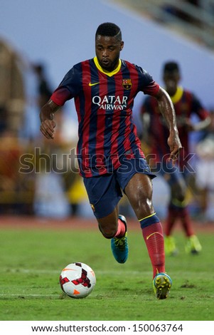 BANGKOK,THAILAND-AUGUST07:Alex Song of Barcelona in action during the international friendly match Thailand XI and FC Barcelona at Rajamangala Stadium on August 7,2013 in,Thailand.