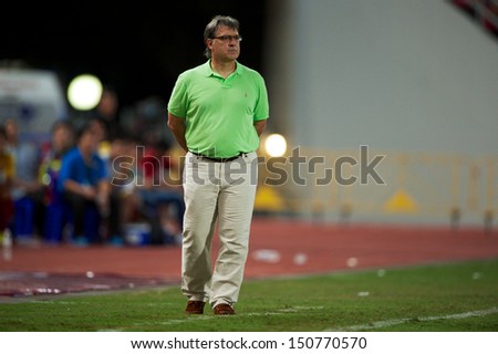 BANGKOK,THAILAND-AU GUST07:Manager Gerardo Martino of FC Barcelona look on during the international friendly match Thailand XI and FC Barcelona at Rajamangala Stadium on August 7,2013 in,Thailand.