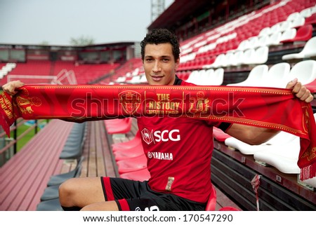 NONTHABURI-THAILAND JANUARY 8: Jay Bothroyd footballer from England pose with scarf  his press conference as a new player for SCG Muangthong United at SCG Stadium on January 8, 2014 in,Thailand