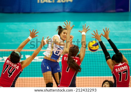 BANGKOK,THAILAND-AU GUST15:Onuma	 Sittirak #6 (L2) of Thailand spikes the ball during the FIVB World Grand Prix Thailand and Dominican Republic at Indoor Stadium Huamark on Aug.15, 2014 in Thailand.
