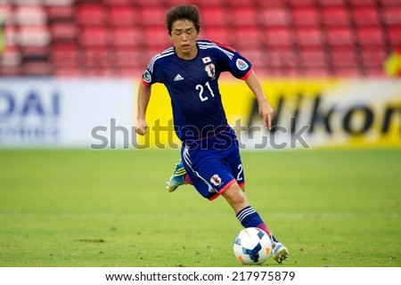 NONTHABURI THAILAND-SEPTEMBER 10:Sasaki Takumi #21  of Japan run with the ball during the AFC U-16 Championship between Australia and Japan at Muangthong Stadium on Sep10 ,2014,Thailand