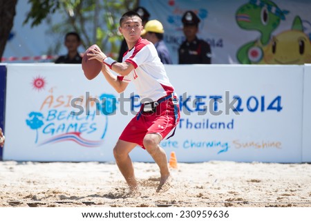 PHUKET,THAILAND-NOVEMBER 13:Nishioka Yoshiya of Japan throws the football during Beach Flag Football Thailand and Japan during the 2014 Asian Beach Games at Saphan Hin on Nov 13,2014 in Thailand.