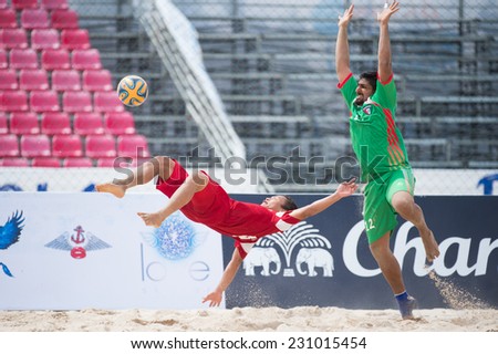 PHUKET THAILAND-NOVEMBER15:Huynh Ngoc Cuong  (L) of Vietnam in action during the Beach Soccer match between Kuwait and Vietnam the 2014 Asian Beach Games at Saphan Hin on Nov 15,2014 in Thailand