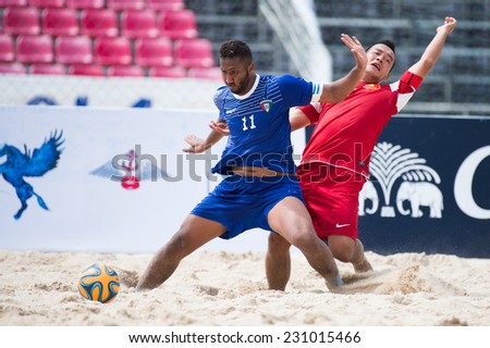 PHUKET THAILAND-NOVEMBER15:Yaqoub Abdulrahman (L)of Kuwait in action during the Beach Soccer match between Kuwait and Vietnam the 2014 Asian Beach Games at Saphan Hin on November15,2014 in Thailand