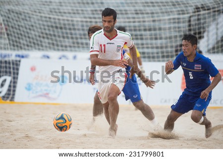 PHUKET THAILAND-NOVEMBER19:Mohammad Ahmadzadeh  (L)of Iran in action during the Beach Soccer match between Thailand and Iran the 2014 Asian Beach Games at Saphan Hin on Nov 19,2014 in Thailand