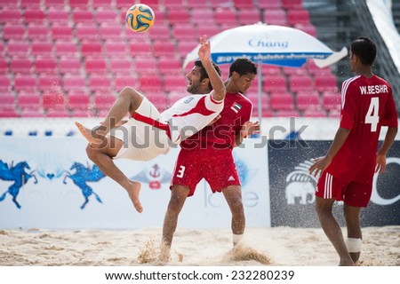 PHUKET THAILAND-NOVEMBER20 :Mohammad Ahmadzadeh(L) of Iran in action during the Beach Soccer match between UAE and Iran the 2014 Asian Beach Games at Saphan Hin on Nov 20,2014 in Thailand