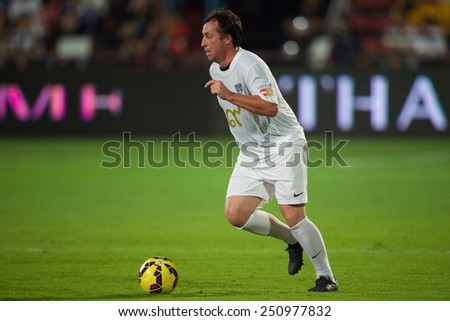 BANGKOK, THAILAND - DECEMBER 05: Robbie Fowler  of team Figo run with the ball during the Global Legends Series match, at the SCG Stadium on December 5, 2014 in Bangkok, Thailand.