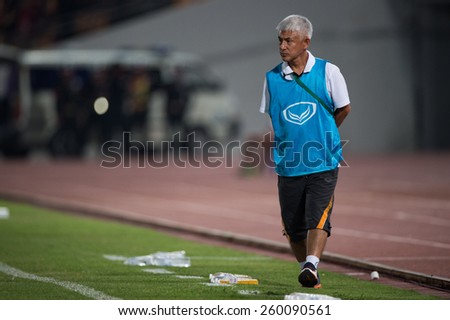 NAKHONRATCHASIMA THAILAND-FEB15:Coach Sugao Kambe of Nakhon Ratchasima look on during the Thai Premier League  Muangthong Utd.and Nakhon Ratchasima FCat 80th Birthday Stadium on Feb15,2015 inThailand.