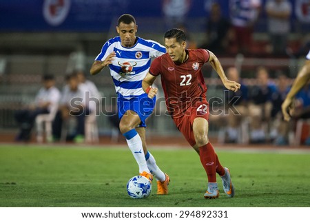 BANGKOK,THAILAND-July8:Chananan Pombupha (RED) of Thailand All Stars in action during The Reading FC Thailand Tour 2015 Thailand All Stars and Reading FC at National Stadium on July 8, 2015,Thailand.