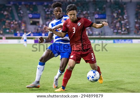 BANGKOK,THAILAND-July8:Suriya Singmui (RED)  of Thailand All Stars in action during The Reading FC Thailand Tour 2015 Thailand All Stars and Reading FC at National Stadium on July 8, 2015,Thailand.