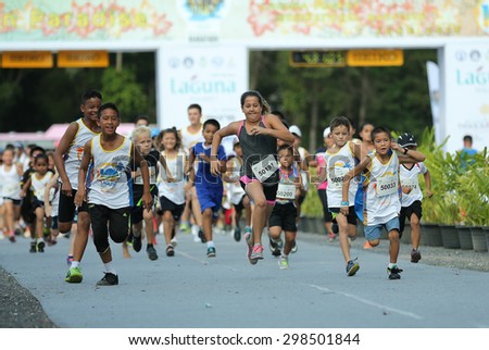 PHUKET, THAILAND - MAY 07: Unidentified children just after the start in a Kids\' Run race during  the Laguna Phuket  International marathon at Laguna on May 07, 2015 in Phuket, Thailand.