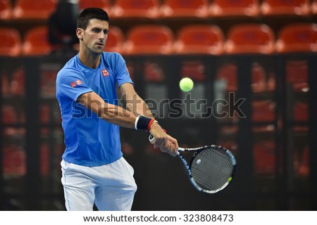 BANKOK THAILAND OCTOBER 01:Serbia\'s Novak Djokovic hits a return the ball during a training session ahead of their exhibition tennis match at the Hua Mark indoor stadium  on Oct 1, 2015 in Thailand.