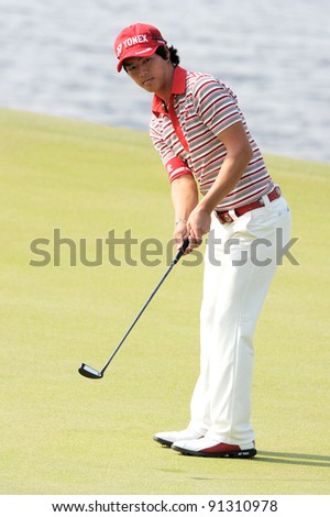 CHONBURI, THAILAND - DECEMBER 15:Ryo Ishikawa of Japan plays a shot during day one of the Thailand Golf Championship at Amata Spring Country Club on December 15, 2011 in Chonburi, Thailand.