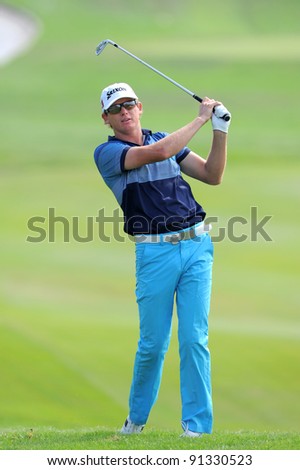 CHONBURI, THAILAND - DECEMBER 15: Adam GROOM of Australia plays a shot during day one of the Thailand Golf Championship at Amata Spring Country Club on December 15, 2011 in Chonburi, Thailand.
