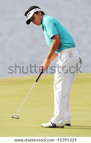 CHONBURI, THAILAND - DECEMBER 15:Ben LEONG of Malaysia plays a shot during day one of the Thailand Golf Championship at Amata Spring Country Club on December 15, 2011 in Chonburi, Thailand.