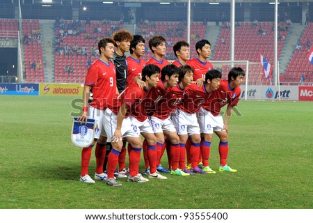 BANGKOK THAILAND-JAN15:Korea Rep team shoot photo before start games during the 41st King\'s cup football between Thailand(Y) and Korea Rep(R)at Rajamangala stadium on Jan15,2012 in Bangkok,Thailand.