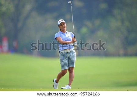 PATTAYA THAILAND-FEBRUARY 16: Ai Miyazato of Japan watches the ball after hits a shot during the first round of Honda LPGA  2012 on February 16,2012 at Siam Country Club Old Course in Pattaya,Thailand