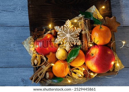 Similar – Image, Stock Photo Mandarine fruits and cinnamon sticks styled on blue cloth background, flat lay, winter theme