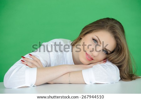 portrait of beautiful young woman over green screen background