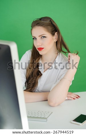 Computer. Laptop.Woman.Girl. Businesswoman.Girl working at the laptop. Studio.green screen background.Space.Smiling. Education center. Business seminar.