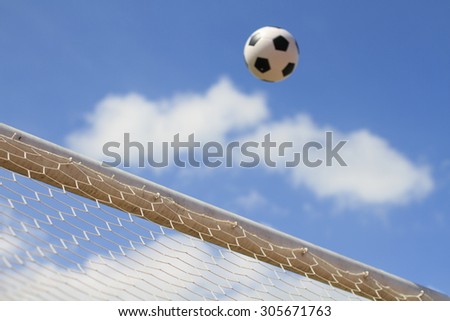 Football goes in the net and makes a goal